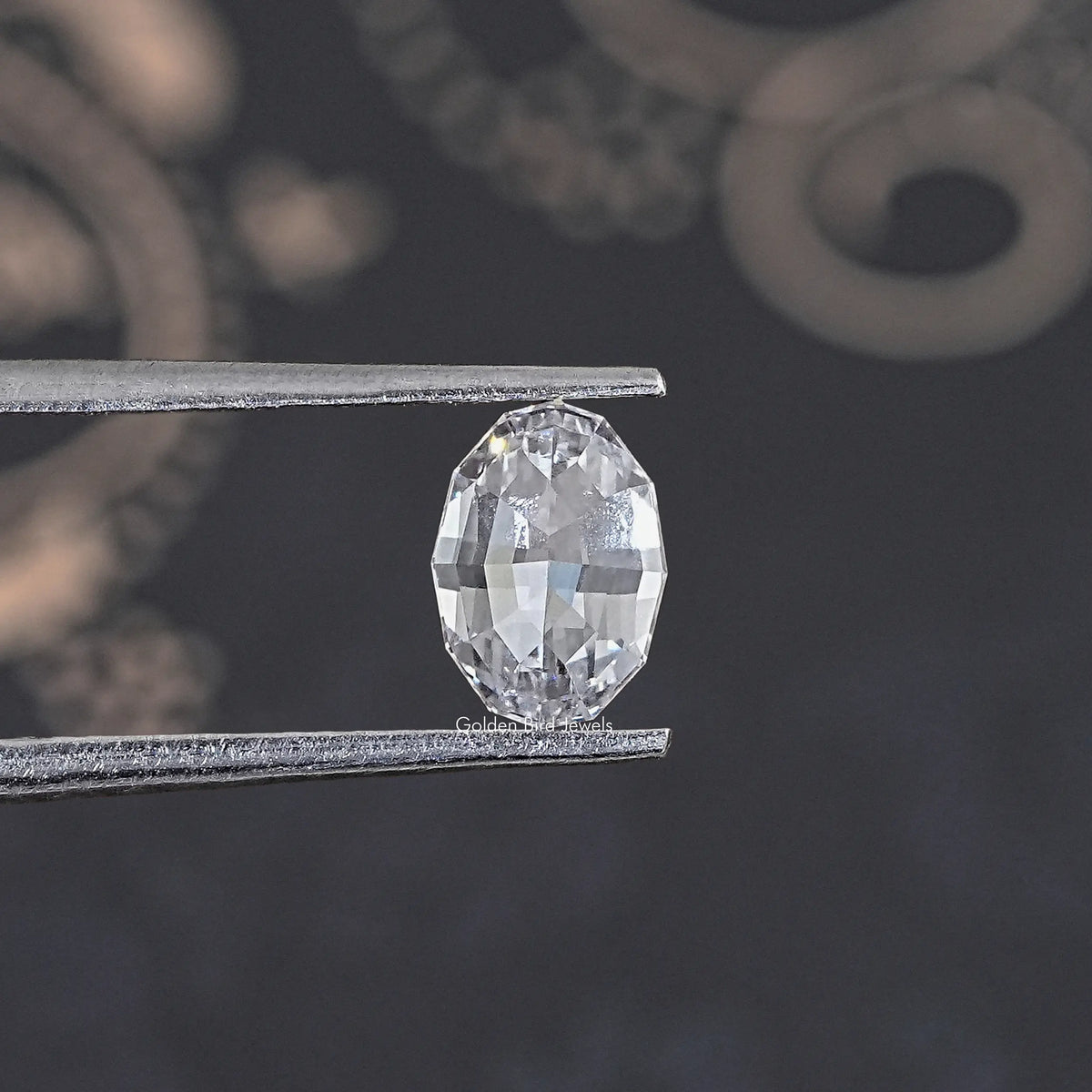 Loose lab-grown oval diamond, step-cut facets in clear tone