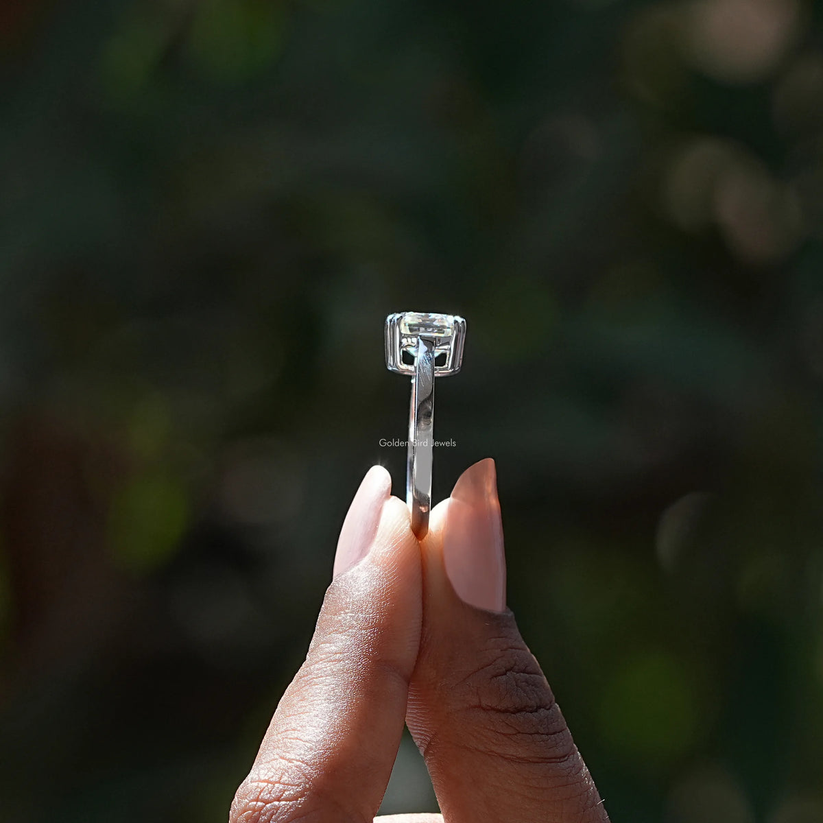 Side View of Asscher Cut Moissanite Ring In two fingers