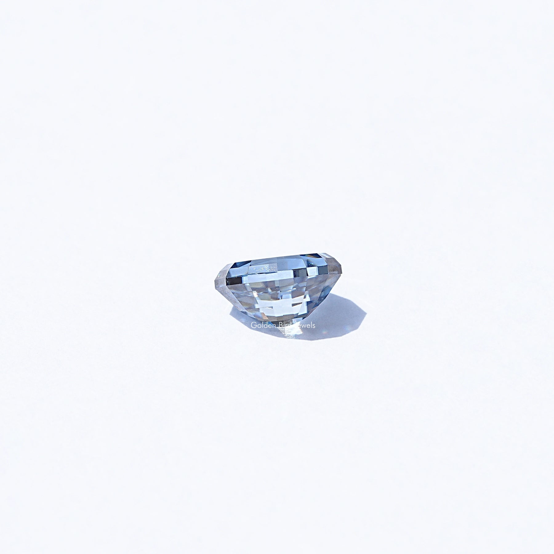 Side View of Moissanite Step Cut Oval Loose Stone In Blue