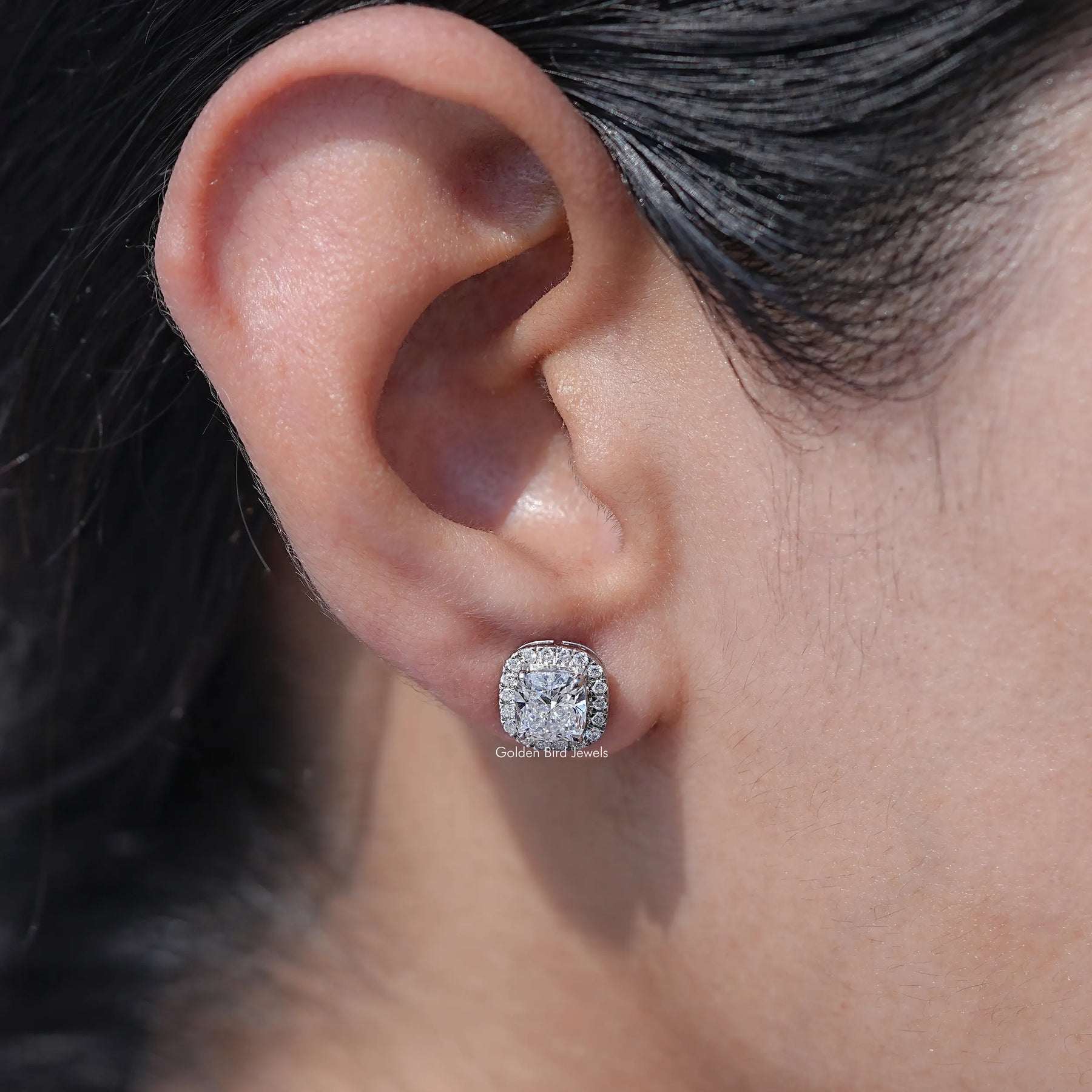 In ear view of cushion cut cluster diamond earrings In White Gold