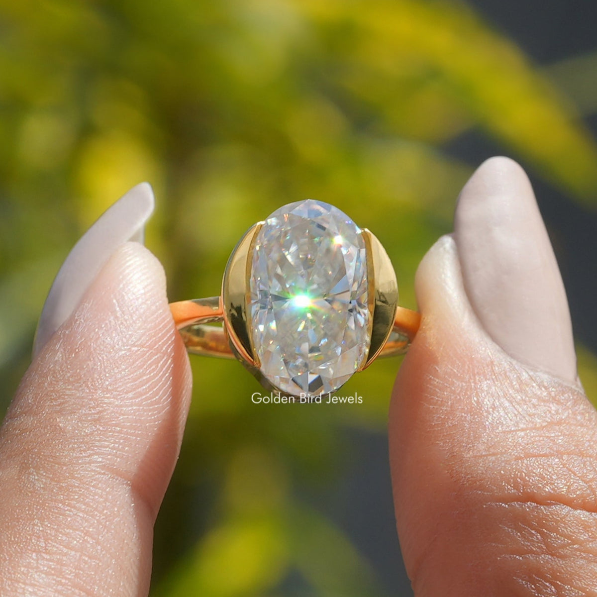 Front View of Moissanite Solitaire Engagement Ring In two Fingers