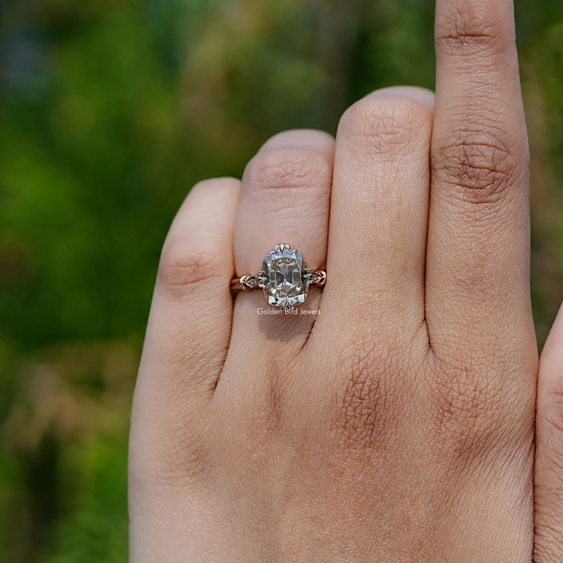 In finger front view of  Cushion Cut Moissanite engagement ring