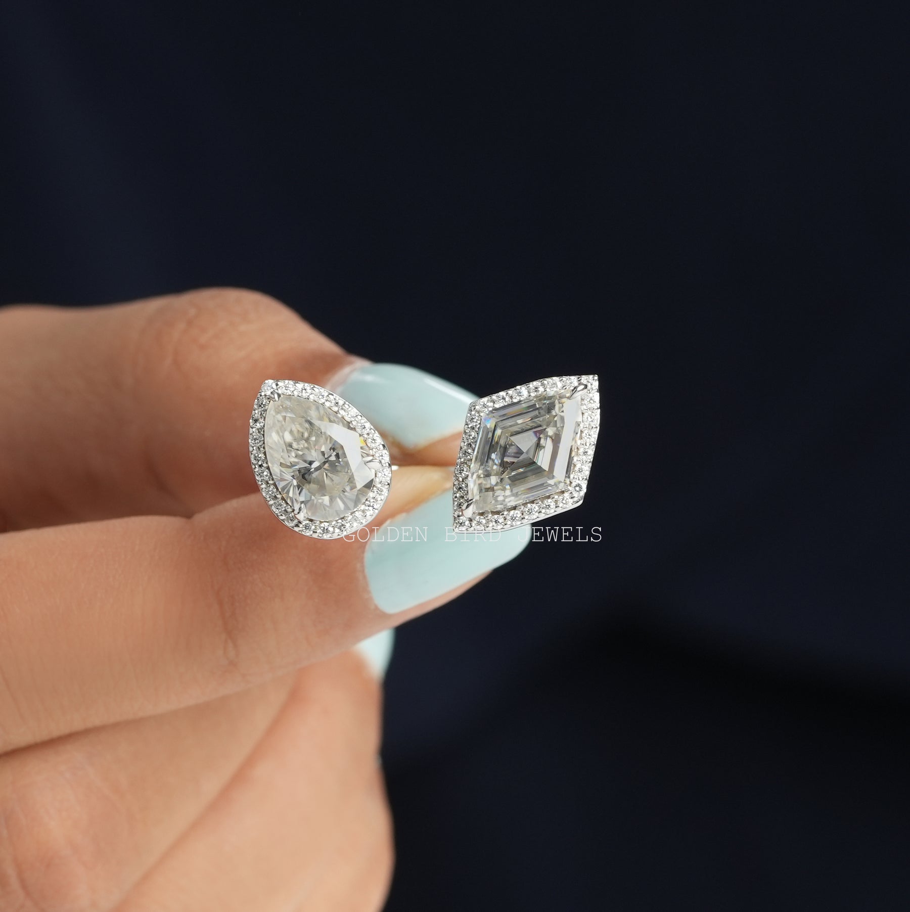 Top view of engagement ring in modified marquies and pear cut moissanite