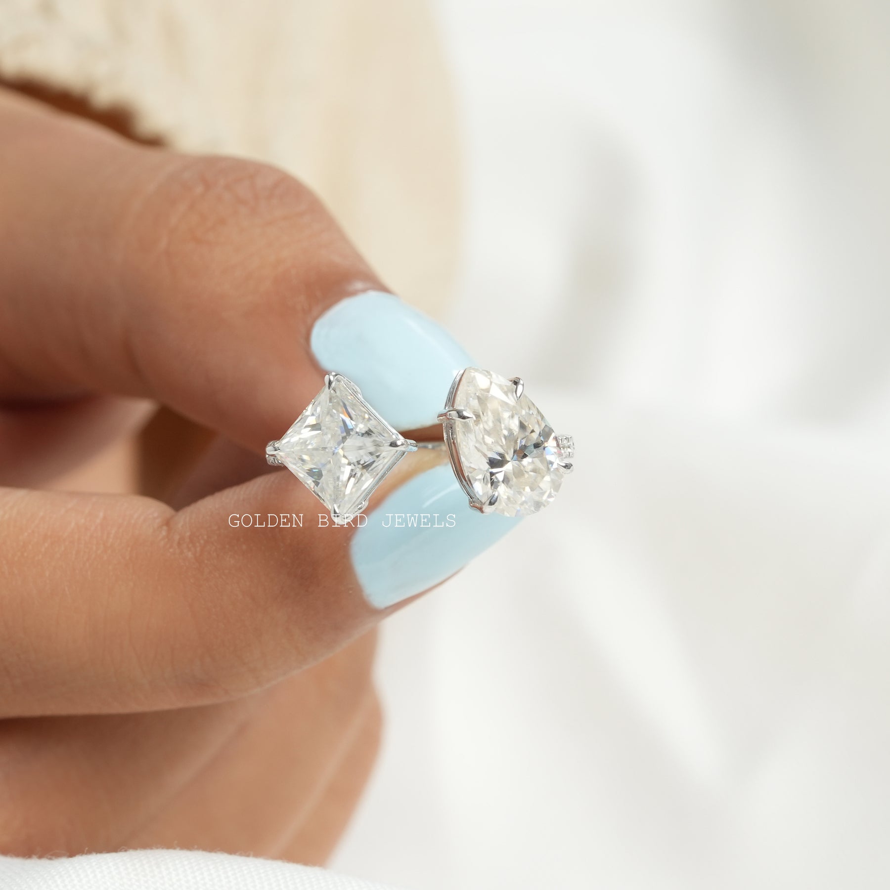 Front View of Princess And Pear Cut Moissanite Toi Moi Ring In two Fingers