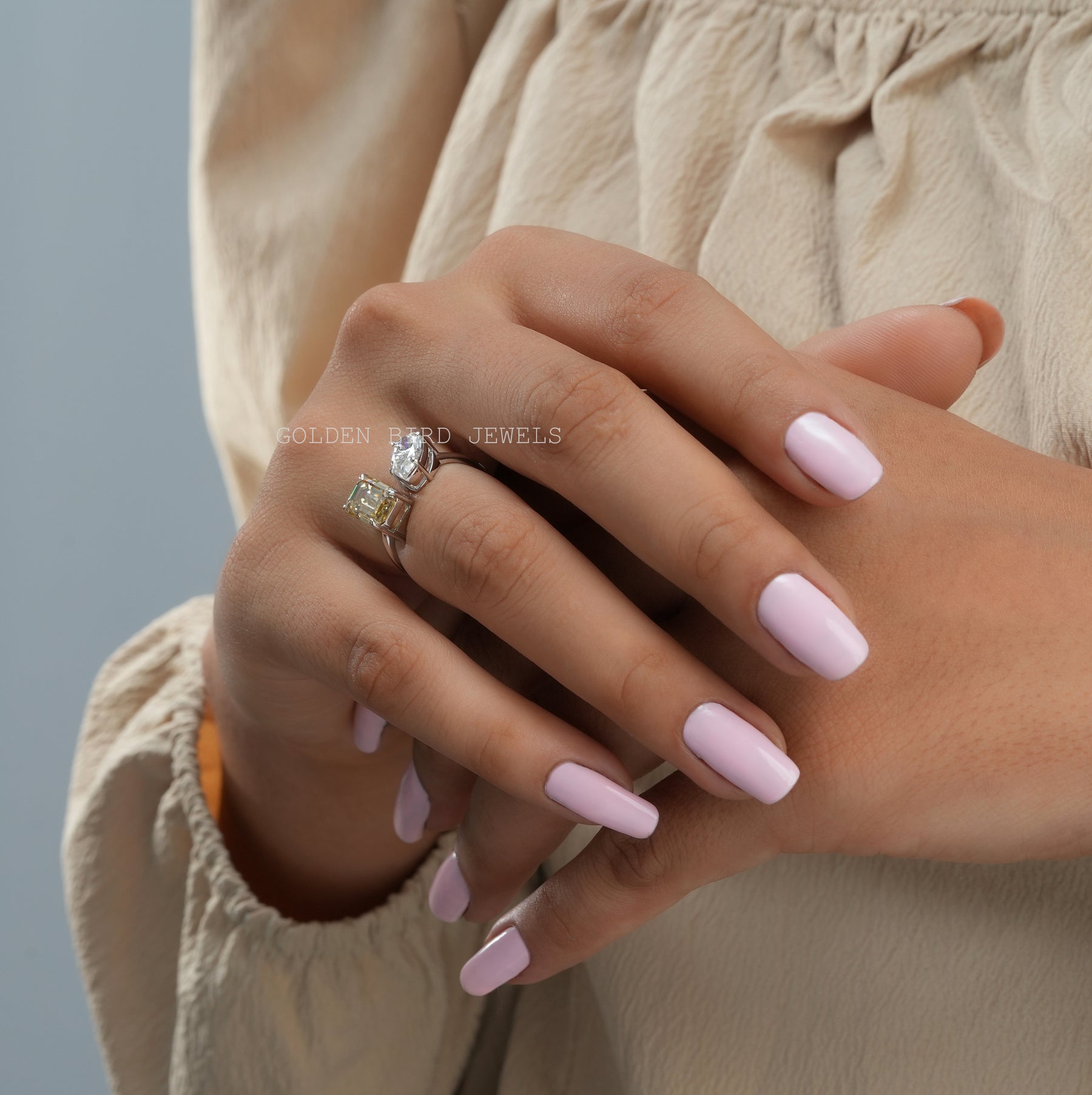 View of Emerald Cut Toi Et Moi Ring In Finger