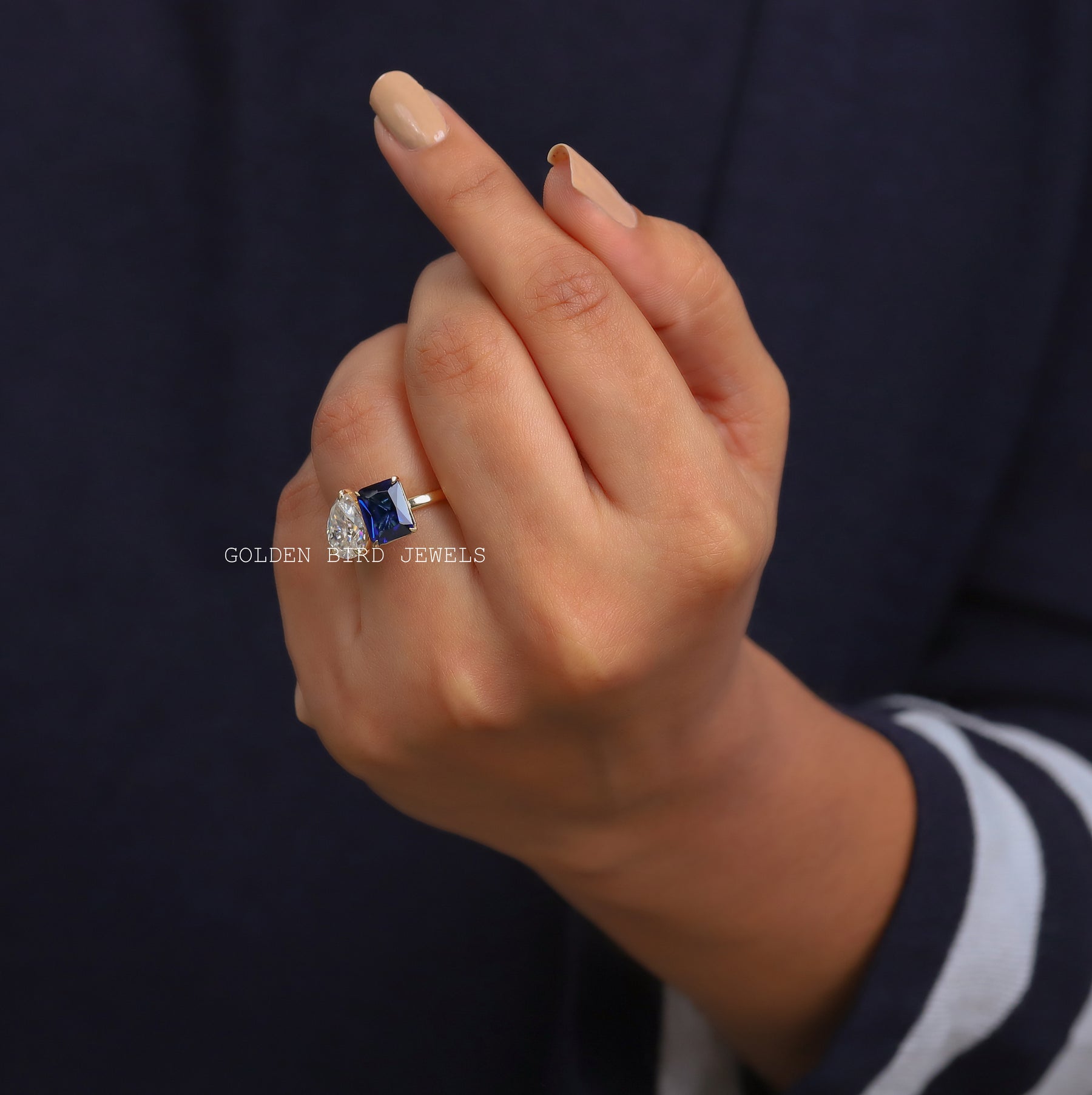 View of Emerald & Pear Cut Moissanite Toi Moi Ring Made In 14k Yellow Gold