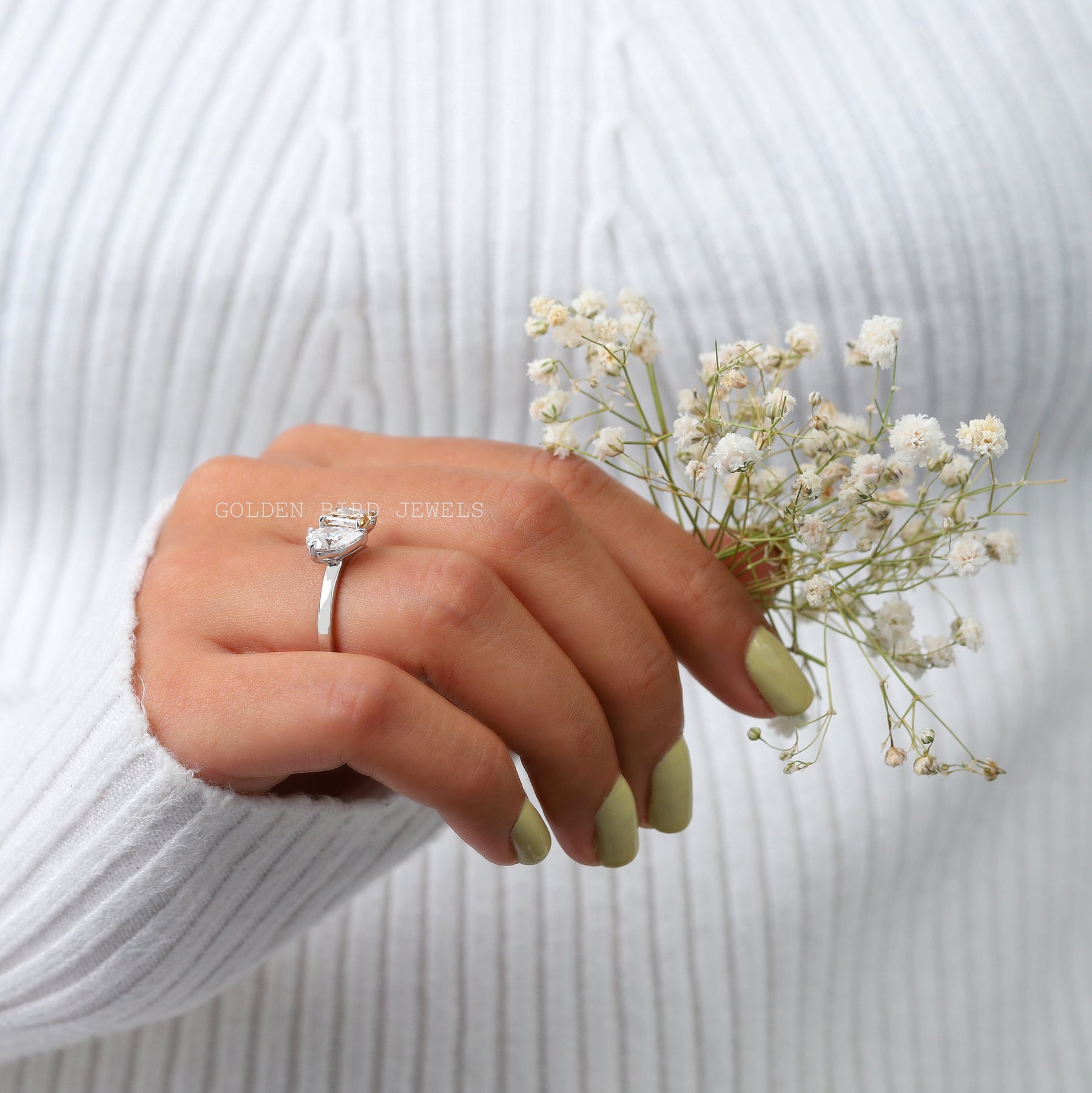 In finger side view of Two brilliance stones engagement ring