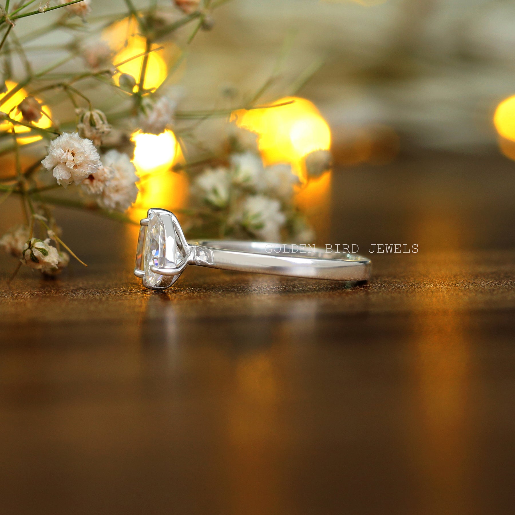 side view of a solitaire princess pear  moissanite ring  for women