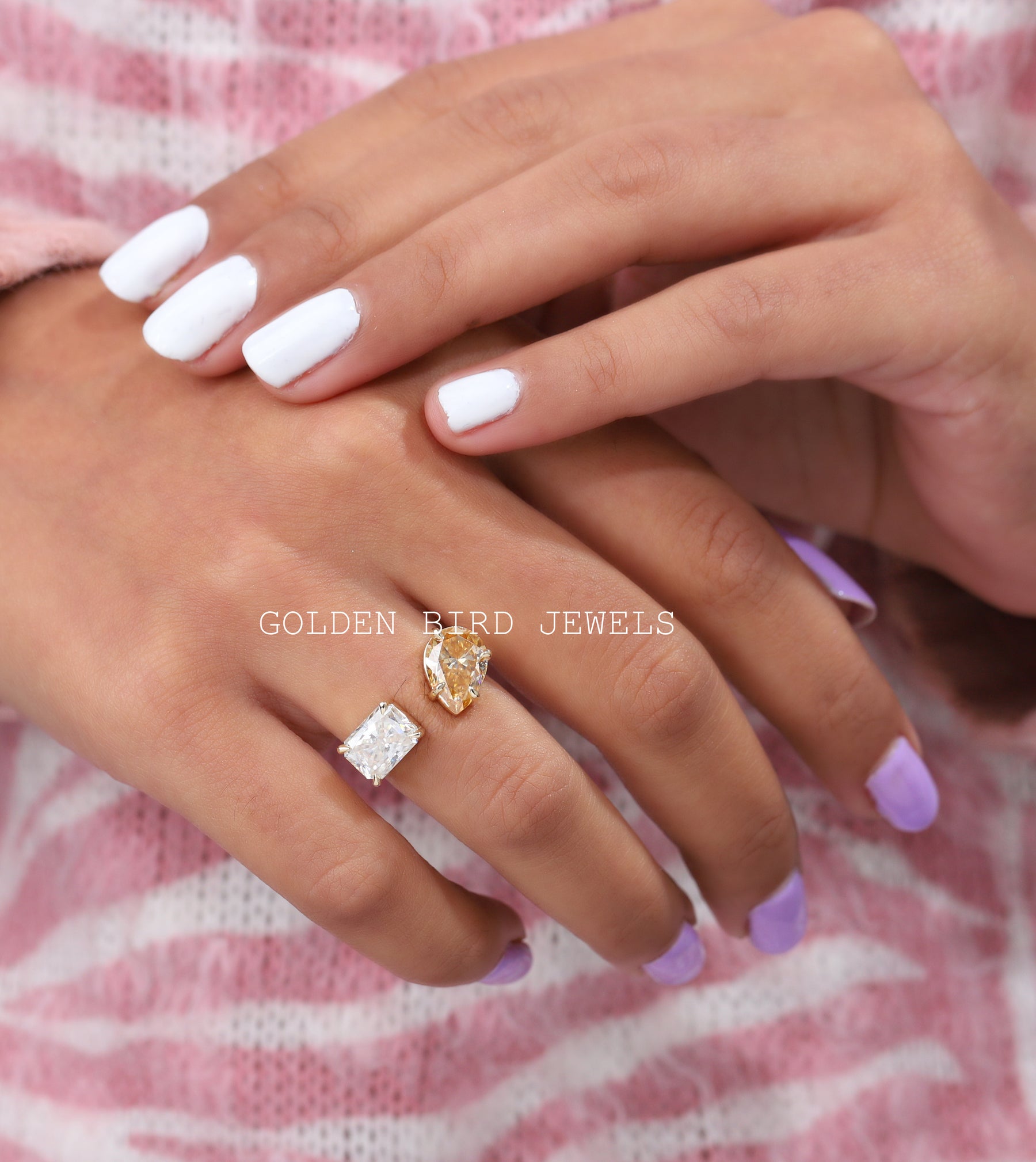 close view of two halo moissanite ring in open shaped