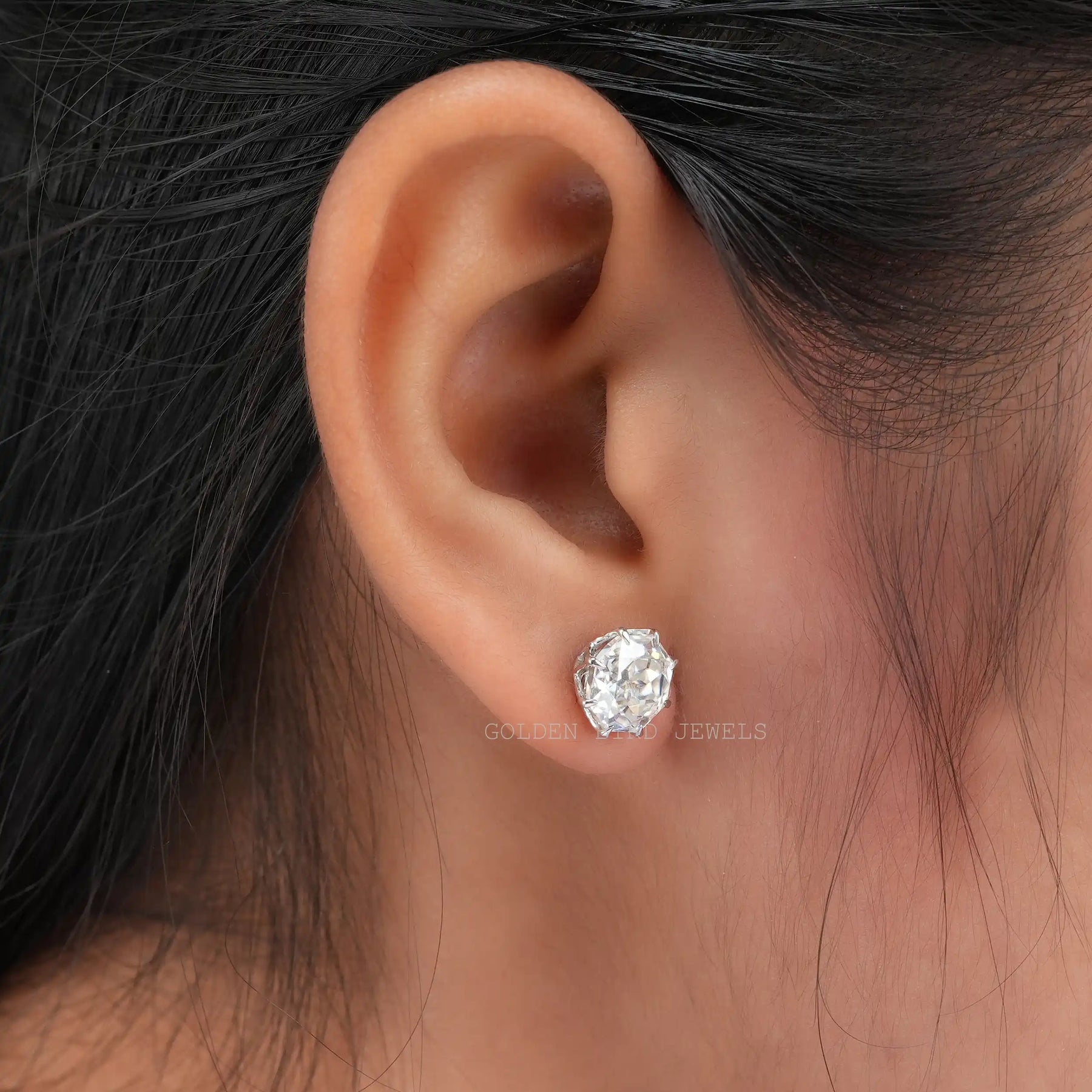 Detailed view of moissanite earrings in secure setting