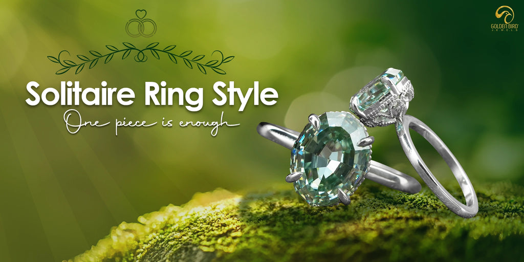 A solitaire Ring made by goldenbirdjewels, placed over beautiful greeen rock,[text] solitaire ring style is written in white color fancy font