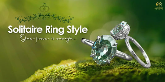 A solitaire Engagement Ring made by goldenbirdjewels, placed over beautiful greeen rock,[text] solitaire ring style is written in white color fancy font