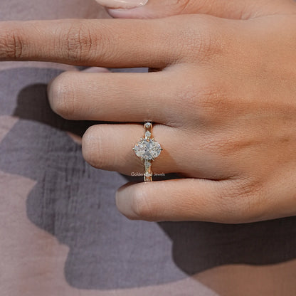 Oval-cut moissanite ring with prong-set center stone and slim sparkling band