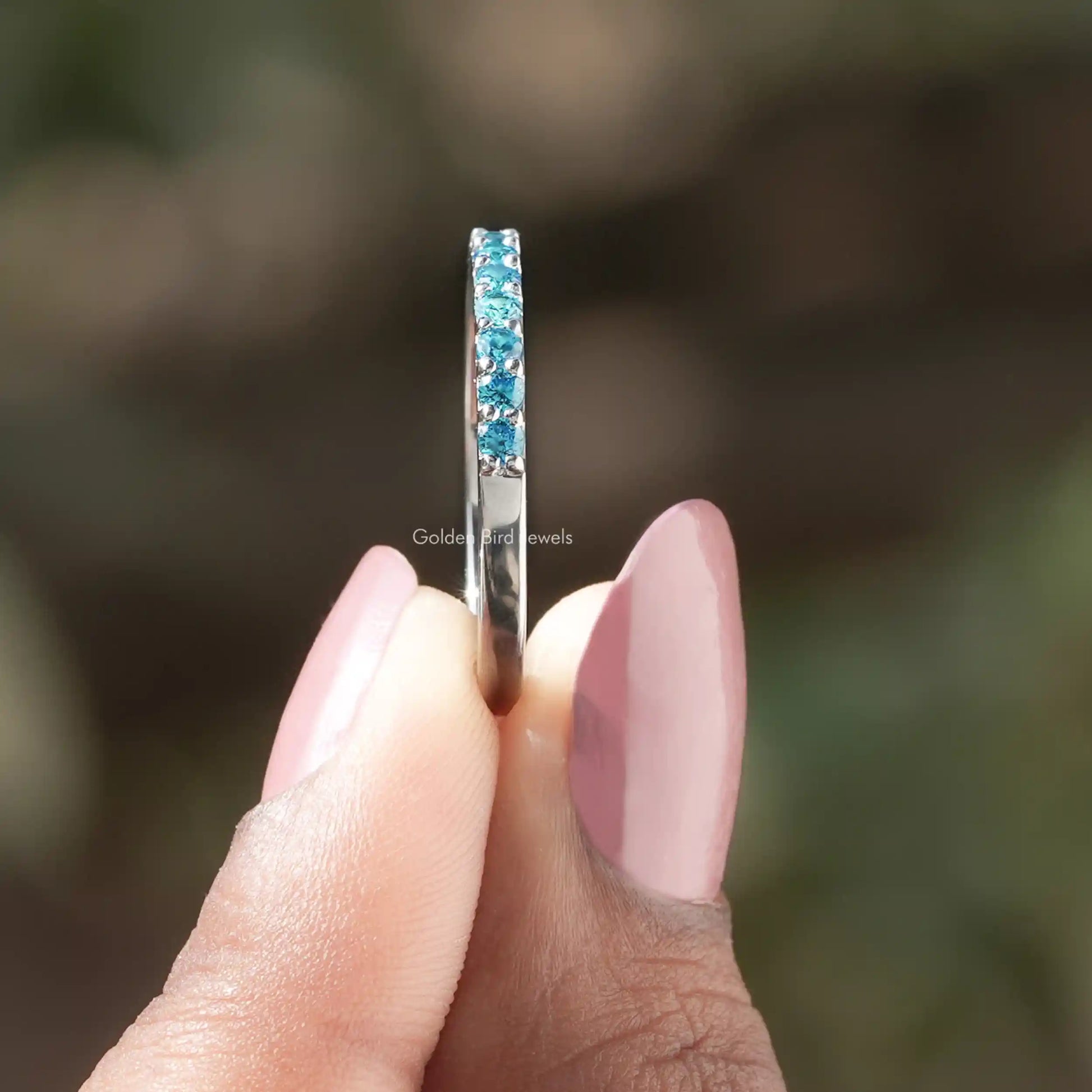 Side View of Aquamarine Blue Round Gemstone Eternity Band