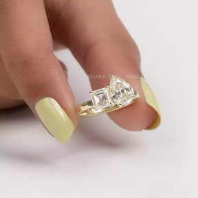 Close view of solitaire  ring holding in two fingers 