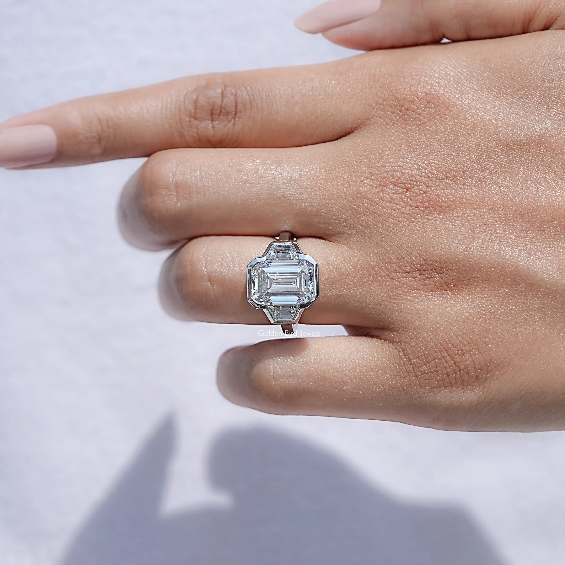 Bezel Set Emerald Cut Lab Diamond Three Stone Ring