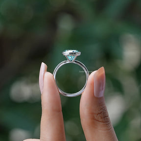 Back View of Round Cut Moissanite Bezel Set Ring In two fingers