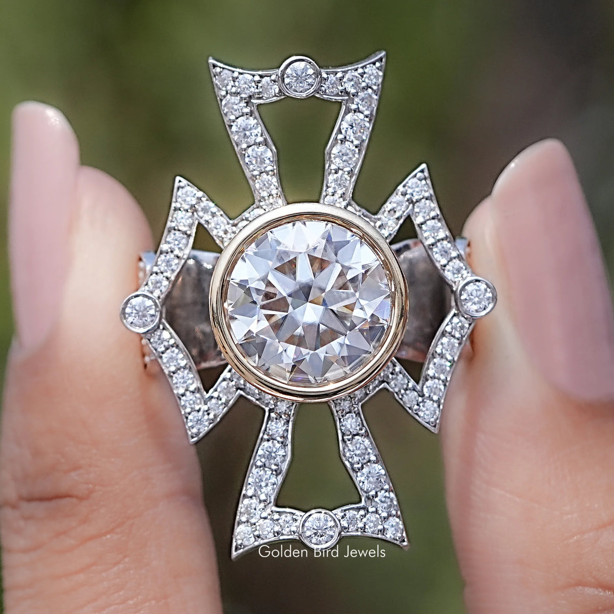 Front view of Bezel Set Round Cut Moissanite Vintage Style Ring in two fingers 
