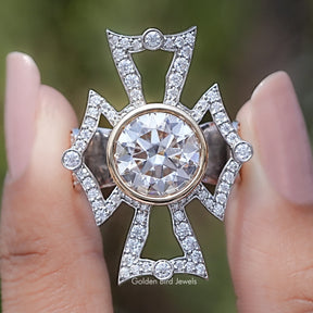 Front view of Bezel Set Round Cut Moissanite Vintage Style Ring in two fingers 
