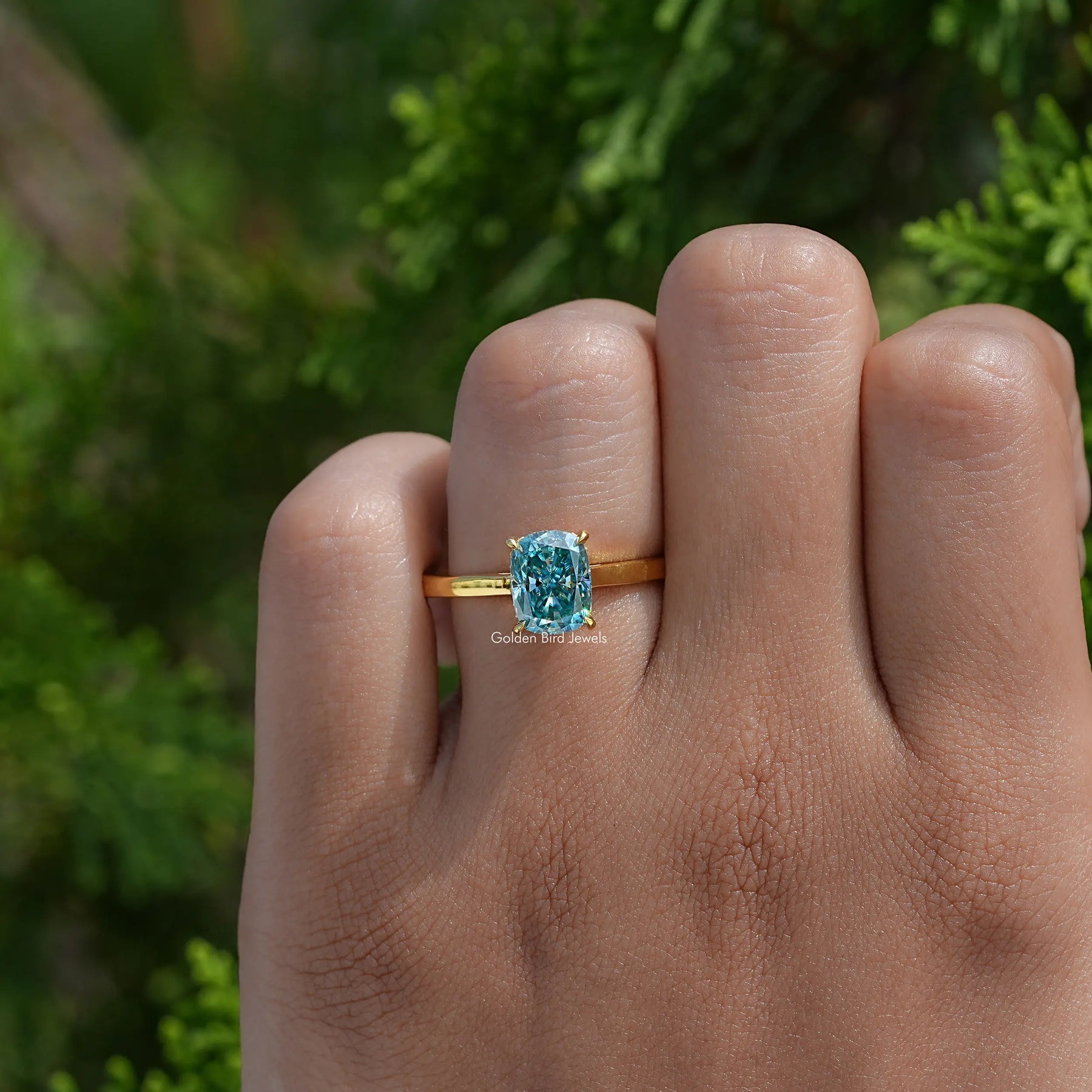 Close-Up View of Cushion Moissanite Engagement Ring In Yellow Gold