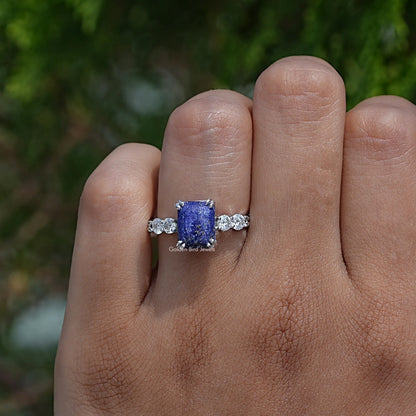 Close-Up View of Double Prong Emerald Cut Engagement Ring In White Gold