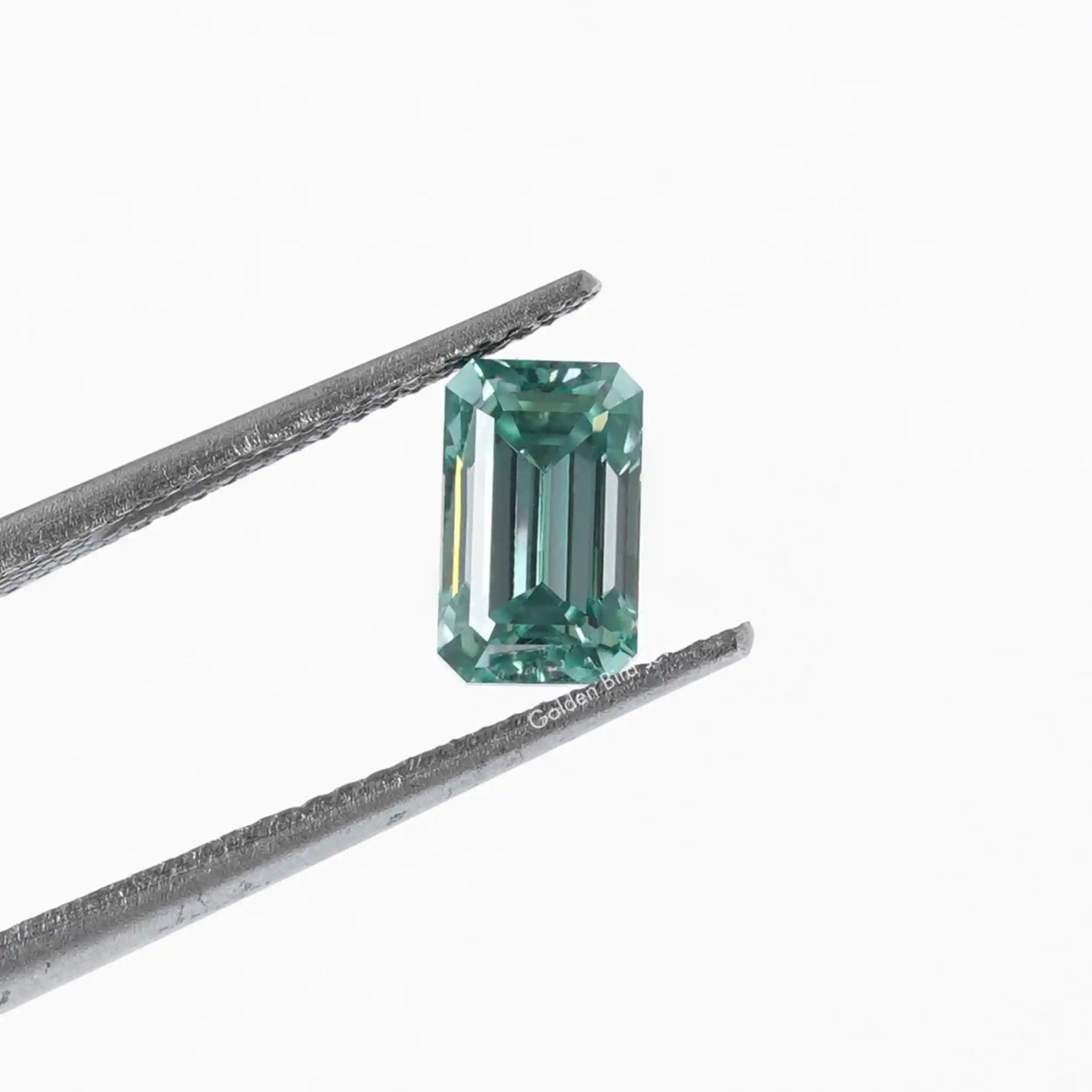 [This emerald cut loose moissanite stone made of blue color]-[Golden Bird Jewels]