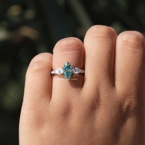 View of Moissanite Marquise And Pear Engagemet Ring In White Gold