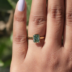 Detailed View Of Radiant Cut Bezel Set Engagement Ring In Yellow Gold