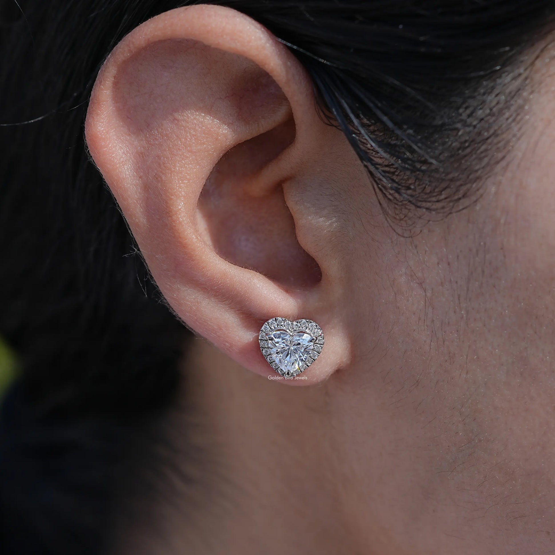In ear view of heart cut cluster diamond earrings