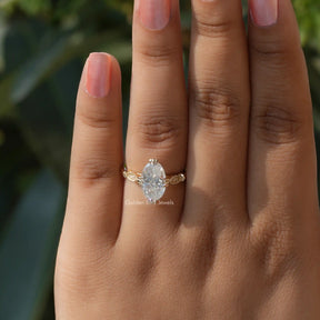 Detailed View Of Moissanite Colorless Moval Cut 3 Stone Ring In Yellow Gold