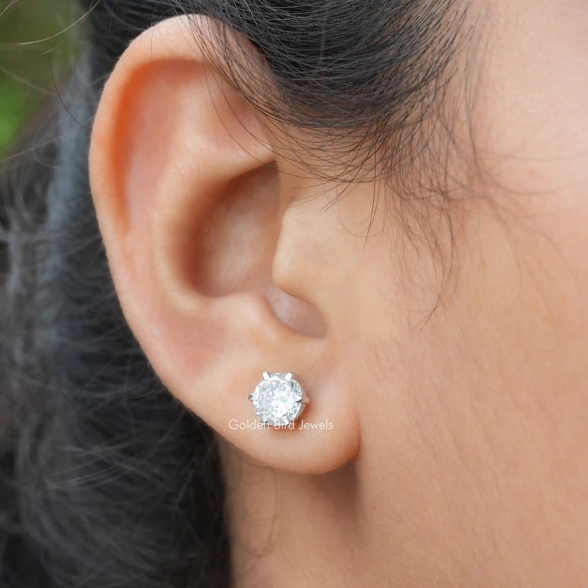 A  Close Up View of a Portuguese Cut Moissanite Wedding Earrings In Six-Prong Setting