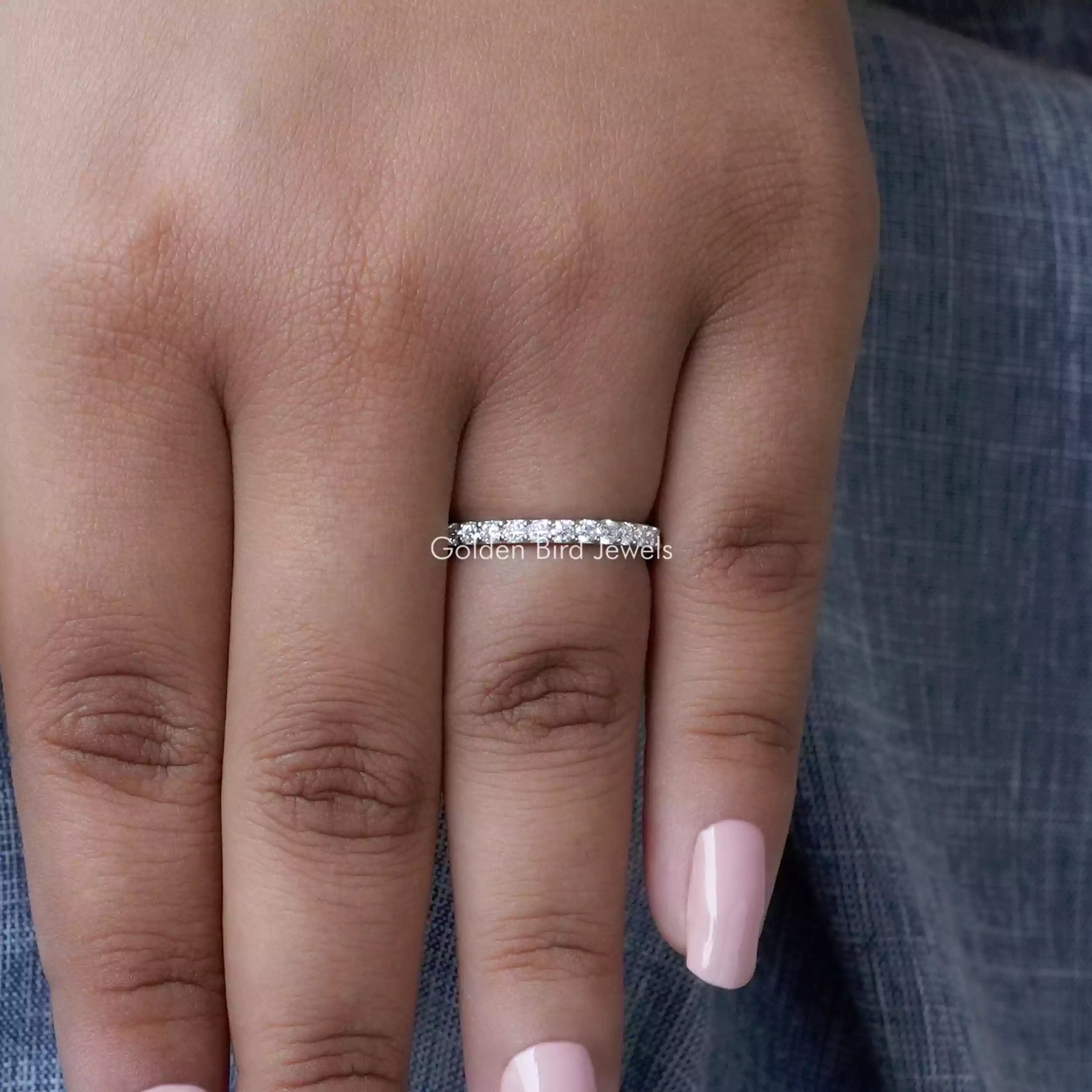 View of Blue Round Cut Moissanite Solitaire Ring in prongs setting 