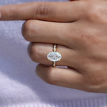 Close-Up View of Oval Cut Moissanite Twist Shank Ring In Yellow Gold