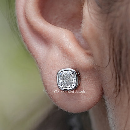 Close up view of Cushion Cut Lab Diamond Bezel Set Stud Earrings
