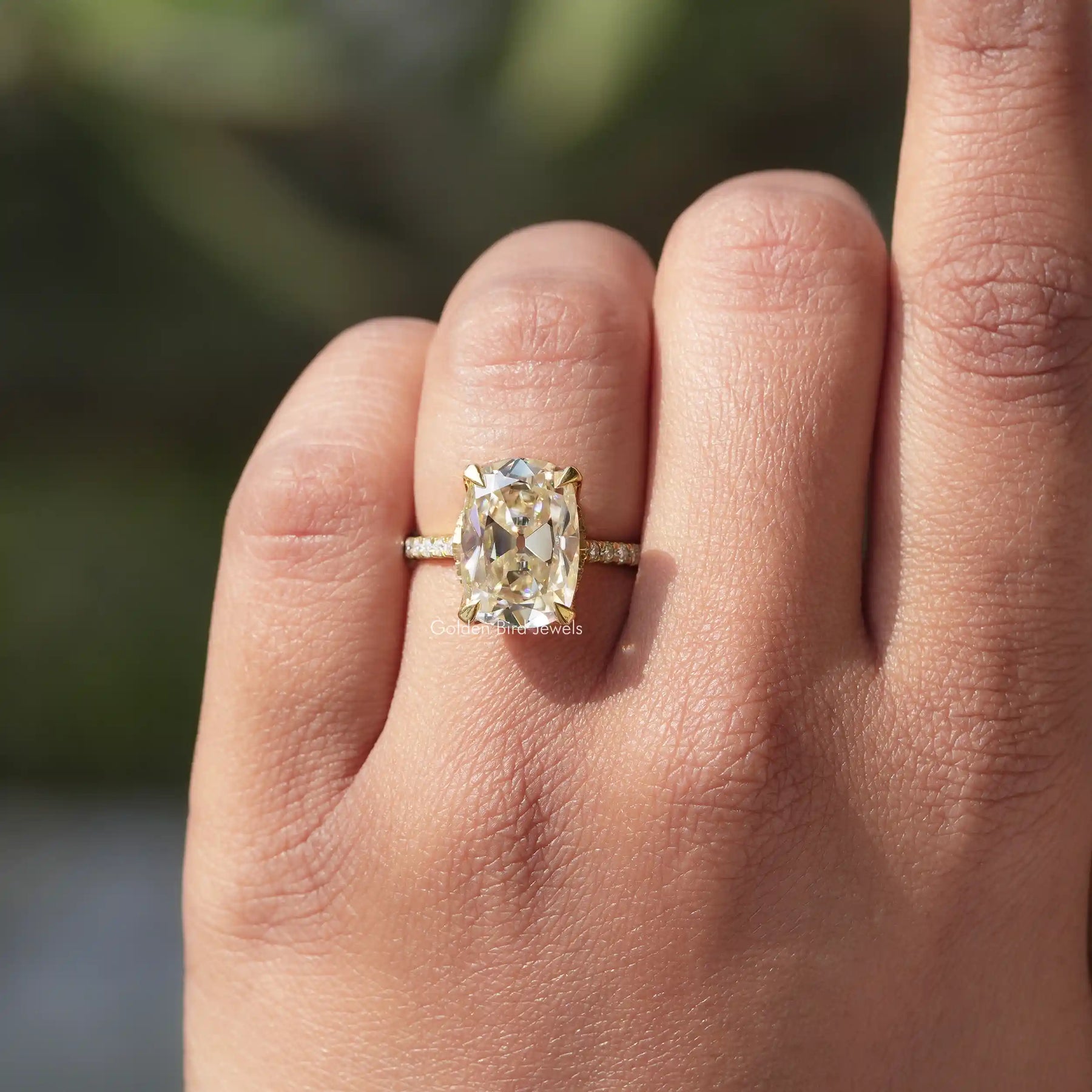 [In finger front view of old mine cushion cut moissanite ring]-[Golden Bird Jewels]