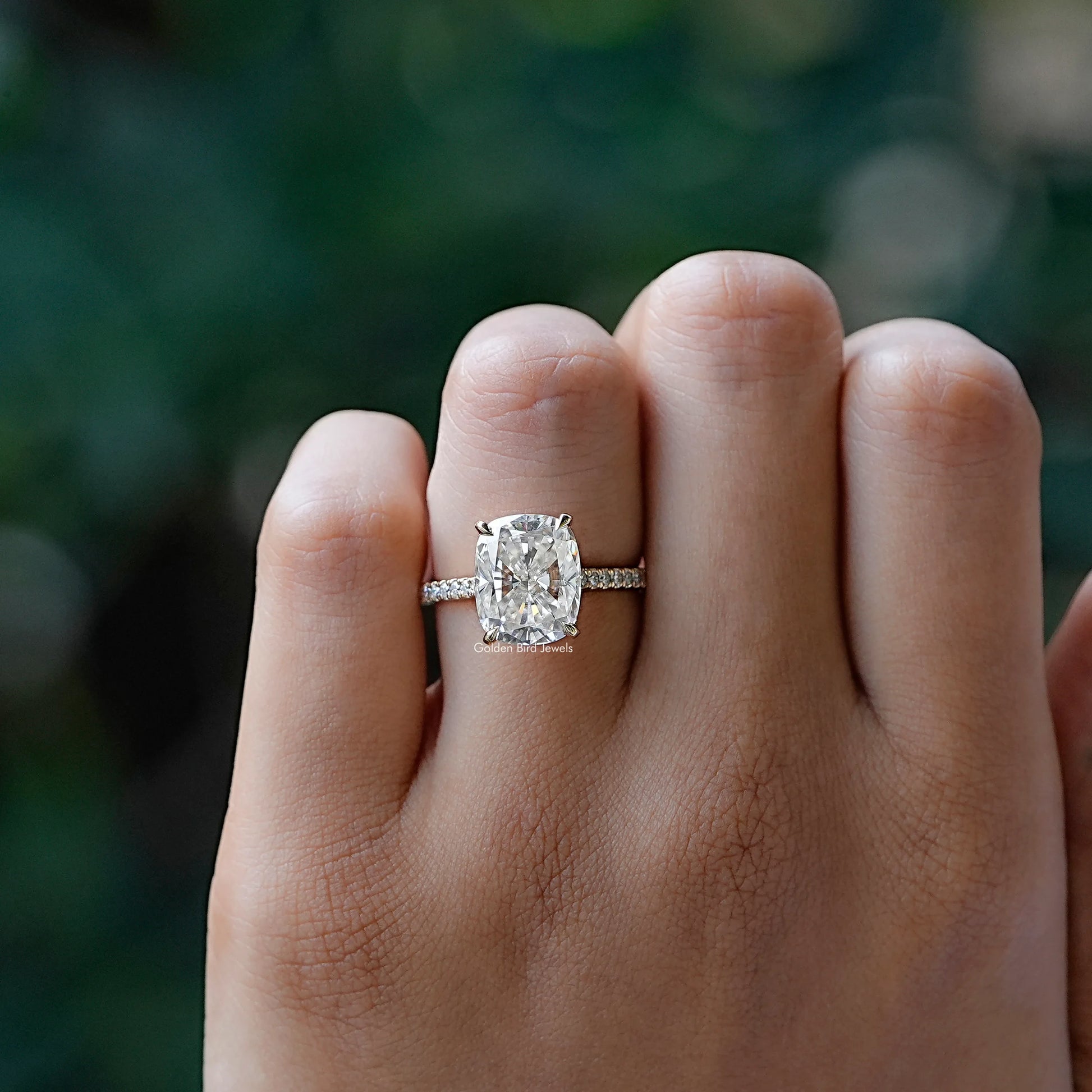 View of solitaire cushion moissanite ring in prongs setting 