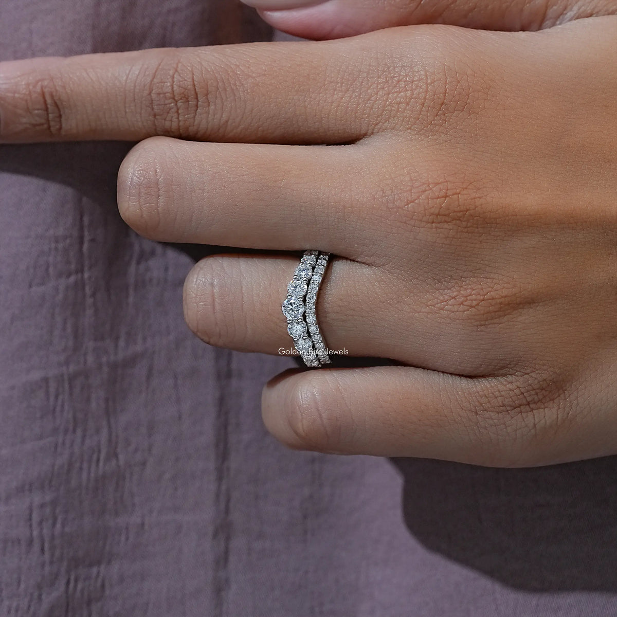 Curved double-row eternity band ring, close-up of small round stones on side