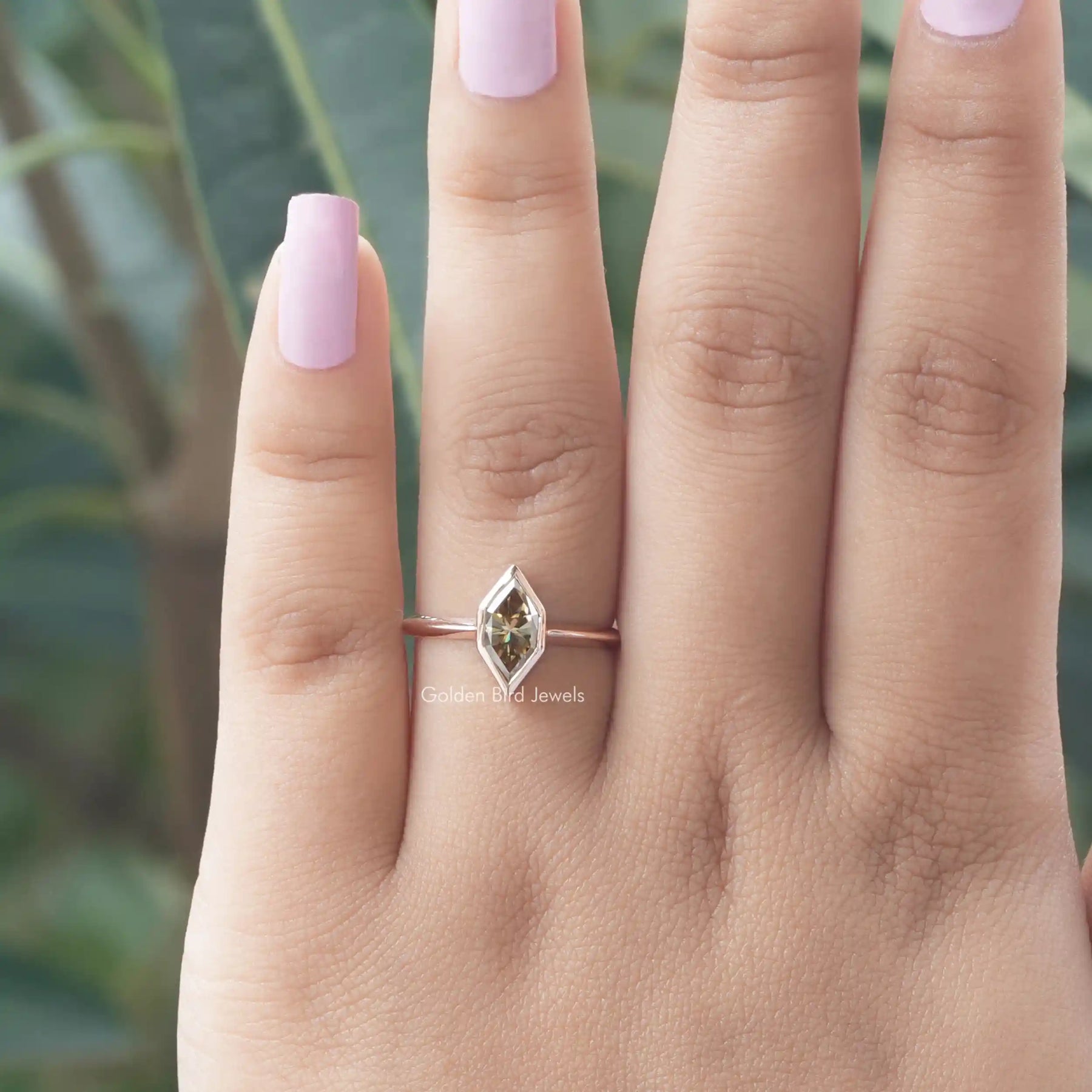 [In finger front view of marquise cut engagement ring in 14k yellow gold]-[Golden Bird Jewels]