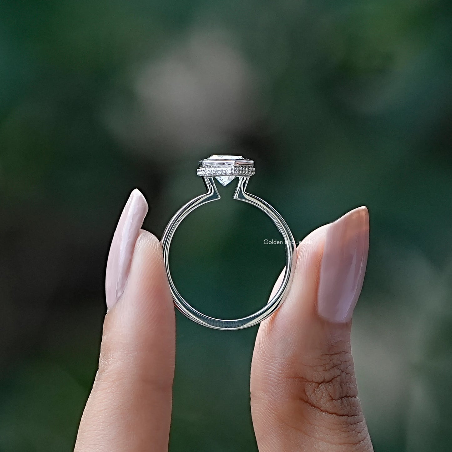 Back View of Marquise Cut Hidden Halo Ring In two fingers