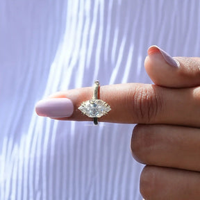 In finger front view of 3 Carat Marquise Moissanite Ring In Yellow Gold