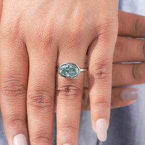 View of Bezel Set Oval Cut Moissanite Ring In finger
