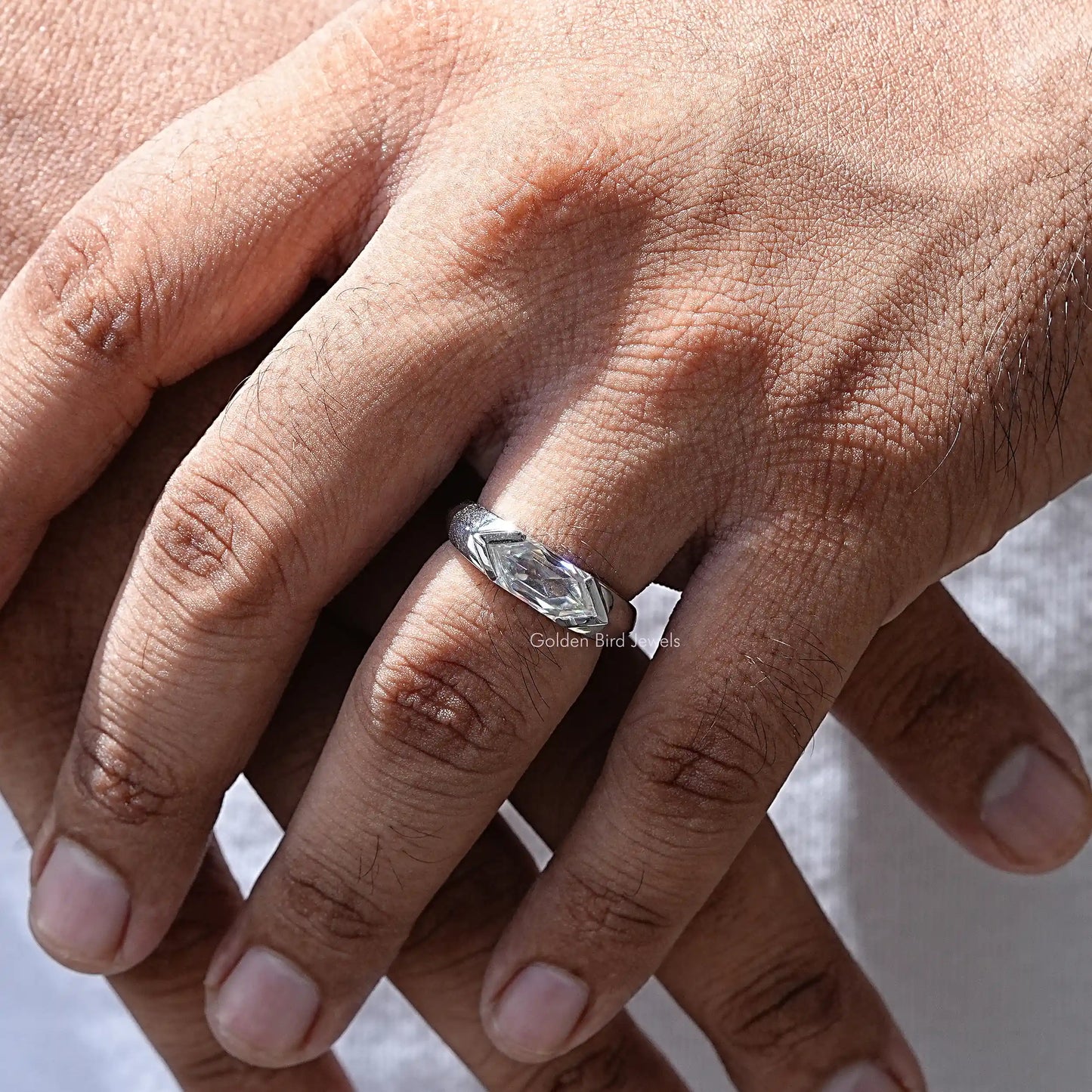 In hand showing a view of moissanite Ring