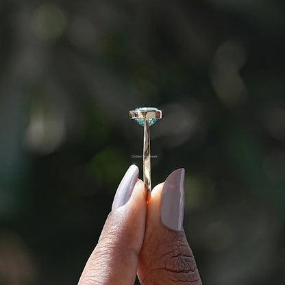 Side View of Moissanite Oval Cut East West Ring In two fingers