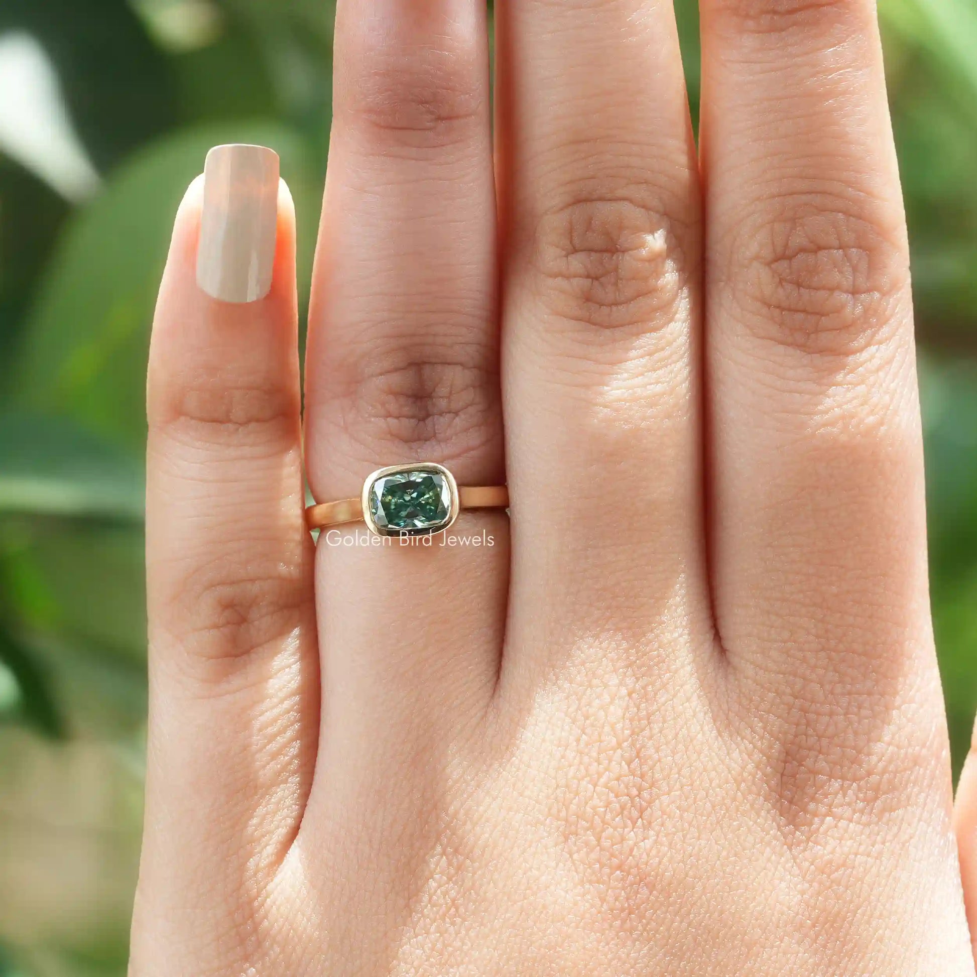 View of Cushion Cut Moissanite Bezel Set Ring In Yellow Gold