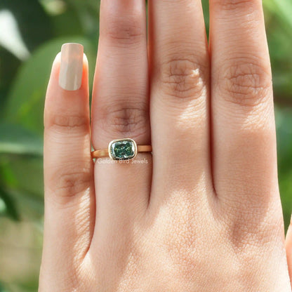 View of Cushion Cut Moissanite Bezel Set Ring In Yellow Gold