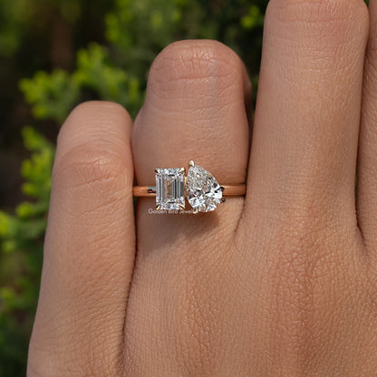 View of Emerald And Pear Cut Lab Diamond Engagement Ring In Finger
