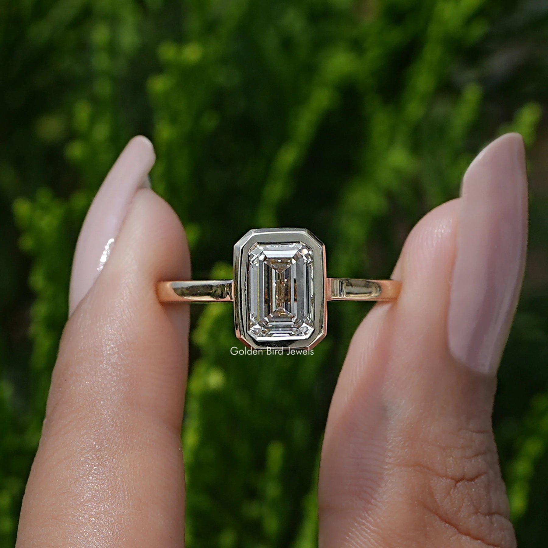 Front View A  Emerald Cut Lab Diamond Ring in a two fingers