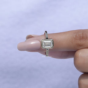 Detailed View of A White Gold Emerald Shaped Ring in a finger