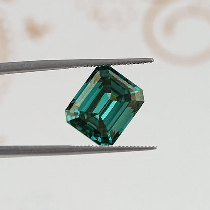 In Tweezer View Of Old Mine Emerald Cut Loose Moissanite Stone