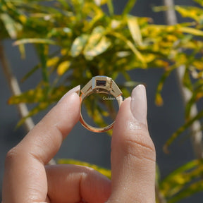 Back View of Emerald Cut Moissanite Bezel Set Ring In finger